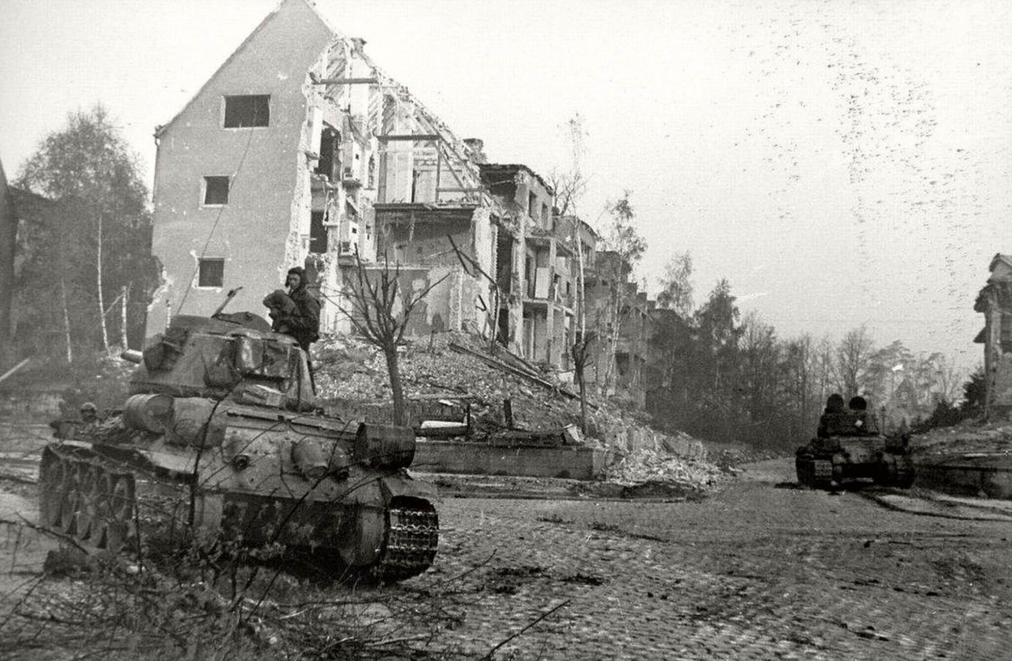 Tank near devastated suburb of Berlin. 